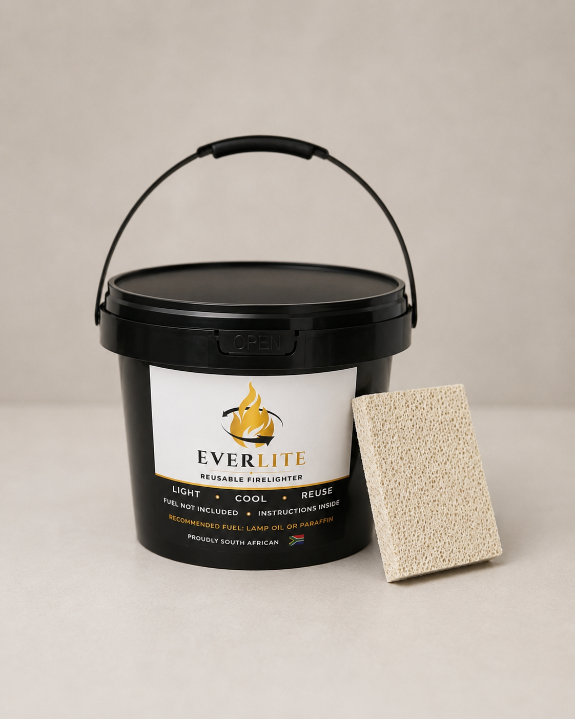 EverLite reusable firelighter container with handle and firelighter stone